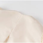 Carmen | Blusa satinada con mangas abullonadas