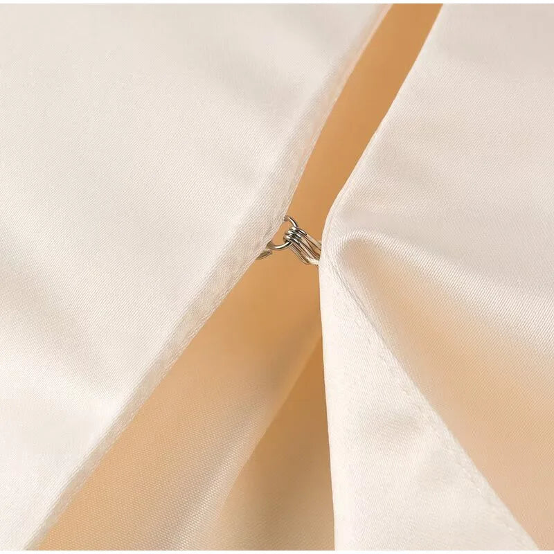 Carmen | Blusa satinada con mangas abullonadas